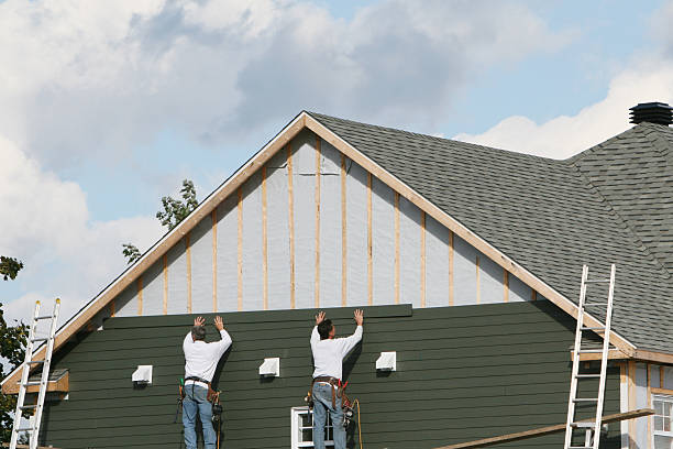 Professional Storm Damage Siding Repair technician working in New Hyde Park, NY